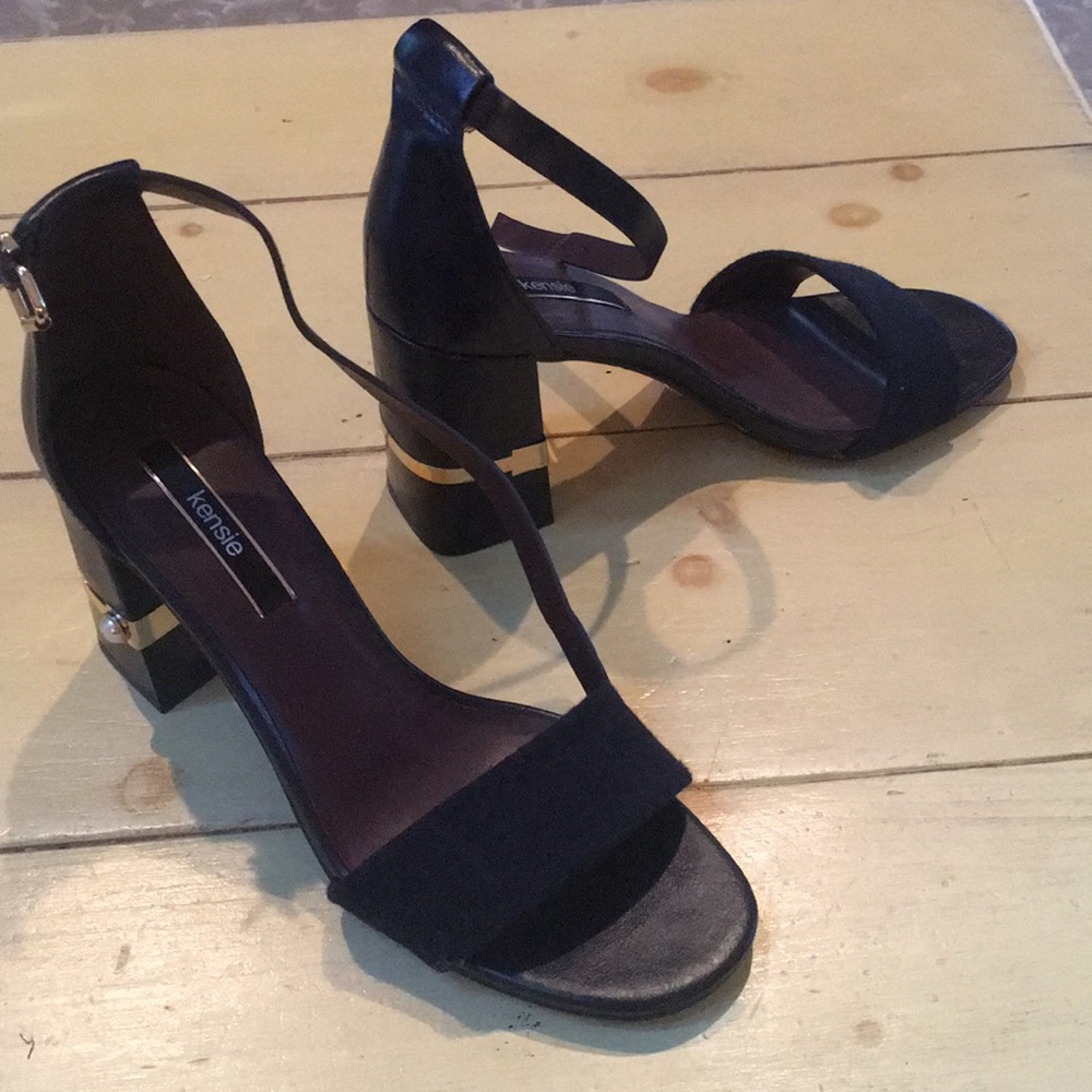 A new pair of Kenzie wedged heeled shoes in navy